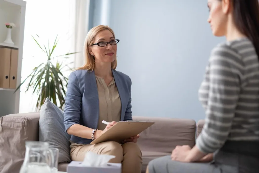 Professional discussing goals for therapy with a patient